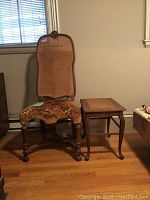 Photo showing antique chair and small bench side by side, chair has caned back and upholstered seat, bench has cane seat.
