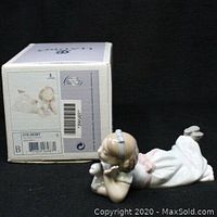 Figurine and original box showing the item number and image of the figurine.