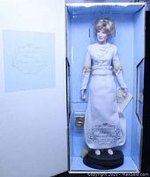 Front view of the Franklin Mint Diana doll in original box showing the gown and accessories.