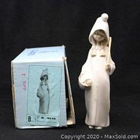 Front view of LLADRO Girl with Basket figurine with original box included, showing overall condition and packaging.