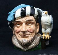 Front view of Royal Doulton Falconer large character jug showing detailed handiwork of falconer face and perched falcon.