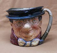 Front profile of Royal Doulton Tony Weller character jug showing detailed facial features and top hat.