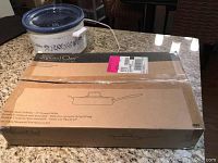 Pampered Chef skillet boxed in original packaging with product labeling visible.