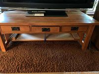 Front view of coffee table showing overall shape and finish