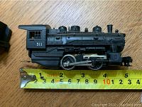 Close-up image of the black steam locomotive model train measuring approximately 5 inches long with the number 511 on the cab.