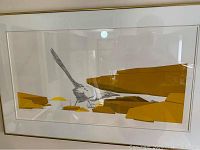 Overall view of framed print hanging on wall