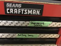 Craftsman logo and labeled drawers marked ‘Sharpening Stones’ and ‘Cutting Saws’