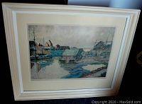 Full view of framed print leaning against a wall