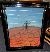 Frontal view of the framed oil painting showing the bird and sky scene with artist signature and logos in bottom right corner.