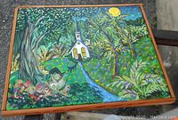 Front angled view of colorful oil landscape painting with church under moonlight and black cat on blue path, signed Poor Lyall.