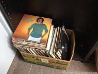 Top view of box with Lionel Richie album on top