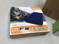 Box of the Intex Classic Downy twin size air mattress showing dimensions and branding.