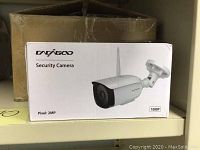 Sealed retail box labeled “Cacagoo Security Camera Pixel: 2MP 1080P” showing product image and antenna