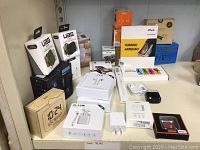 Shelf view showing assortment of boxed items and loose accessories