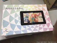 Closed retail box showing XP-PEN Artist 15.6 Pro branding and graphic pattern