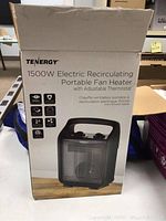 Front view of the box showing product name, brand Tenergy, and an image of the heater.