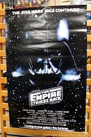 Front of the poster showing Darth Vader artwork and text.