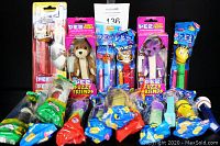 Front view showing entire collection of PEZ dispensers, most sealed including fuzzy friends variety and open stock items in front.