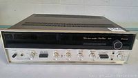Full frontal view of vintage Sansui 5000 stereo receiver with visible control knobs and black tinted display