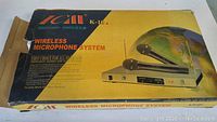 Box of ICM K-10 wireless microphone system showing product branding and image on front of the box.