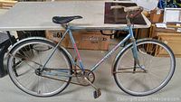 Side view of vintage CCM Breeze bicycle, showing frame, wheels, fenders, seat and handlebars