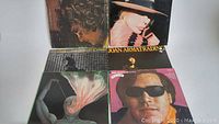 Photo showing 5 vinyl records placed close together, featuring artists including Joan Armatrading and Jose Feliciano
