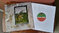 Outer sleeve of Led Zeppelin IV album with visible wear and album cover art.