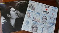 Front cover of John Lennon Double Fantasy album showing John Lennon and Yoko Ono kissing.