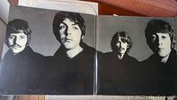 Black-and-white photo inside the gatefold cover showing the four Beatles members.