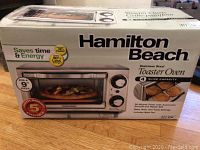 Front view of sealed box showing product image and main features.