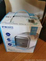 Boxed HoMedics MyChill Personal Space Cooler 2.0 showing front and side design and branding