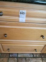 Three drawers unit containing the kitchenware items