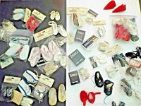Overview of assorted Tallina's doll shoes laid out on dark surface showing packaging and loose pairs.