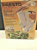 Presto Salad Shooter electric slicer/shredder in original box showing front of packaging and product labeling.