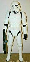Front view of a 31-inch Star Wars Imperial Stormtrooper figure holding a gun, with white armor and black details.