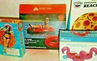 Photo shows multi boxes including Ozark Trail River Tube red inflatable, flamingo drink raft, and giant pizza beach ball packaging.