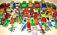 A collection of 43 various Hot Wheels type sports cars, trucks, and model cars arranged closely together on a surface.