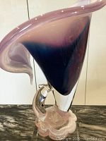 Front view of large Murano mouthblown glass Jack-in-the-pulpit style vase showing purple shading and clear glass base with bubble accents.