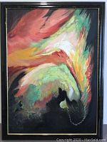 Full view of mid-century original oil painting in black frame with thin gold trim, abstract swirling design with reds, yellows, greens, whites, and blacks.