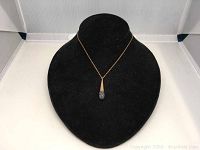 Rose gold necklace with Swarovski Cypress pendant displayed on black bust.