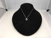 Swarovski Kathy double pendant necklace shown on black velvet display bust, front view.