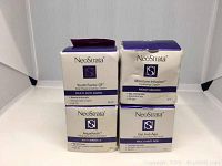 Four boxed Neostrata creams displayed with front labeling visible, showing product names and details.