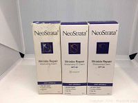 Front view of three NeoStrata Wrinkle Repair skincare product boxes: two Moisturizing Creams and one CC Cream SPF 30 with universal tint.