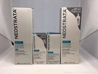 Front view of four Neostrata Restore skincare products in original boxes including hydrating facial cleanser, face creams, and bionic lotion.