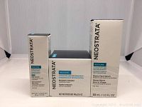 Three boxed Neostrata Restore skincare products including Eye Cream, Moisture Infusion cream, and Bionic Face Serum.