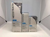 Three Neostrata Clarify products: Mandelic Clarify Cleanser 200ml, Acne Clarifying Solution 100ml, Dual Acid Clarifying Peel 50ml, in original packaging.