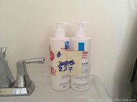 Two 400ml white pump bottles of La Roche-Posay Lipikar Balm AP+ balm, providing anti-itch and lipid replenishing benefits for dry skin.