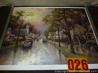 Full view of the lithograph showing the street scene and vintage cars in a rainy town setting.