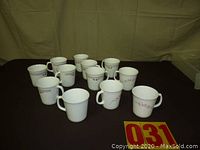 12 CorningWare cups arranged on a surface showing overall lot