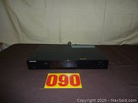 Front view of Samsung Blu-Ray player showing Samsung branding and disc tray.